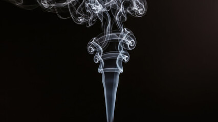 wisps of smoke rising against a dark background with intricate patterns.