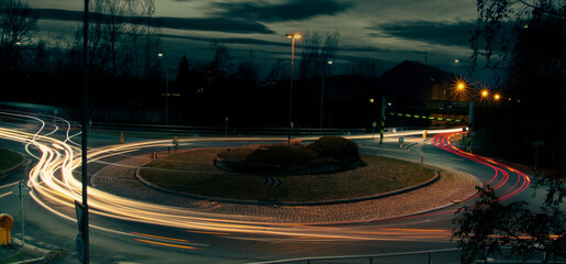 Long exposure light trails on roundabout at night