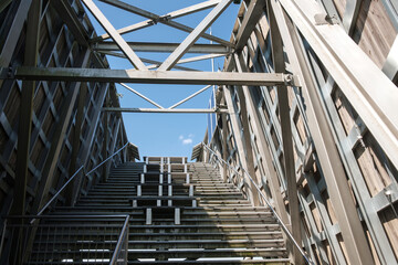 Architecture with steel stairs and wooden elements. Route up the observation tower