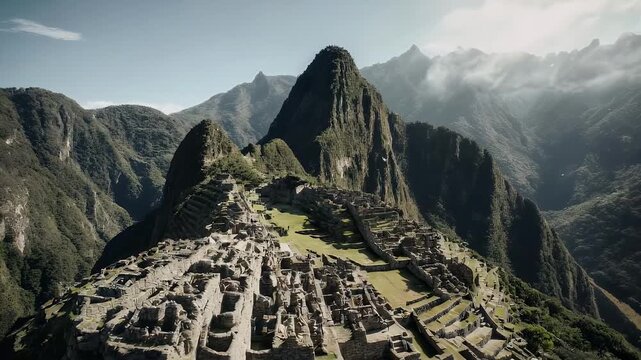 Aerial view of an ancient settlement nestled amidst rugged mountains, partially shrouded in mist. The structure exhibits stonework