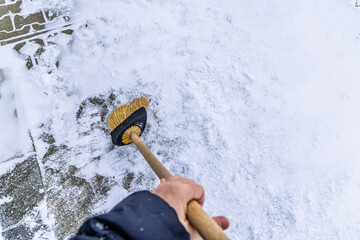 Removing snow from the pathway and street, winter cleaning