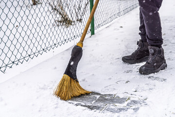 Removing snow from the pathway and street, winter cleaning