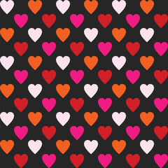 Pattern created from neon pale pink, pink, orange and red  hearts on a black background