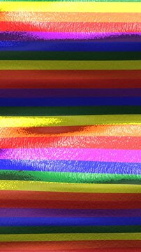 Seamless funny vertical video of a wavy rainbow background in shining rubber fabric. Gay pride backdrop.