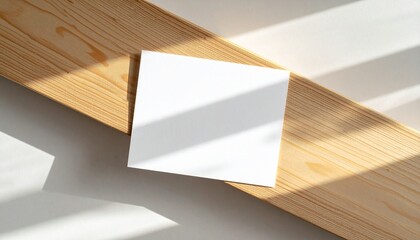 Clean White Square Card Mockup with Soft Shadows on Natural Wood Surface