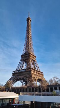 Paris, France - December 10, 2025: View from a cruising boat trip along the Seine river to the breathtaking Eiffel Tower. The iconic Parisian landmark as global attraction. French trip symbol