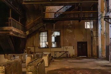 Derelict industrial hall with brick installations