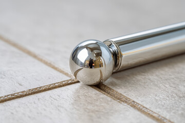 Sliding ceramic gate halting chrome sphere at boundary line, compliance control concept