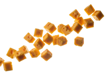 Irregularly shaped golden-yellow cheddar cheese cubes in suspended scattering motion on transparent studio background, soft lighting. Concept of healthy indulgence and premium quality