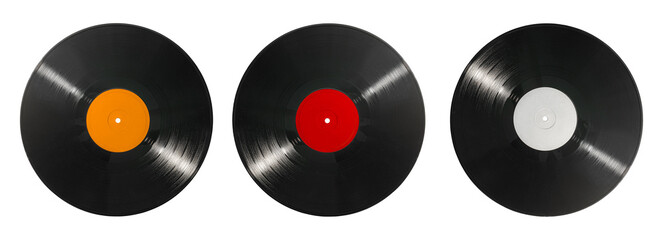 Vinyl records set isolated on white background. Old CDs, music. Three black vinyl discs with different colored labels, top view, music, analog sound, retro media, DJ and audio concept. © Oleksandr
