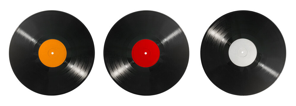 Vinyl records set isolated on white background. Old CDs, music. Three black vinyl discs with different colored labels, top view, music, analog sound, retro media, DJ and audio concept.
