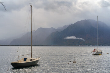 Two Yachts or sailboats in lake of geneva on mountain background