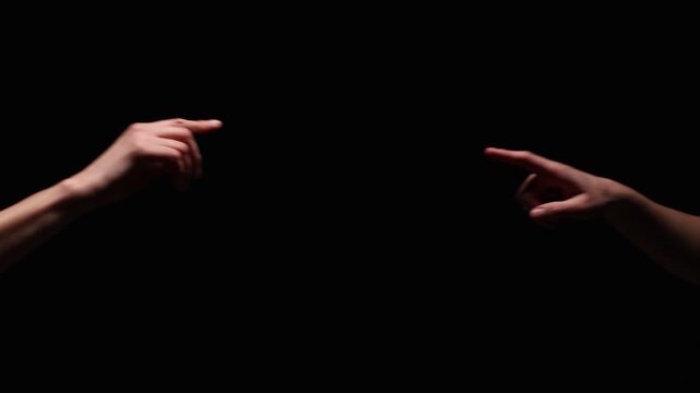 Two outstretched arms reach toward each other, with index fingers gently touching, evoking connection and intimacy. Black background with ample copy space