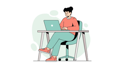 Young woman working on a laptop at a desk in a modern office environment