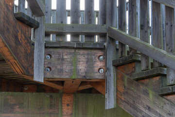 The lower structural unit of a wooden platform with bolted connections.
