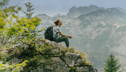 Woman Viewing Mountain Range and Forest Landscape During Hike or Adventure in Nature