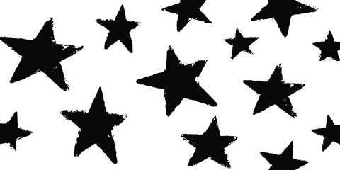 Obraz premium A simple, grunge-style pattern of black stars on a white background. A hand-drawn, grunge-style pattern featuring various sizes of black stars on a simple white background. 