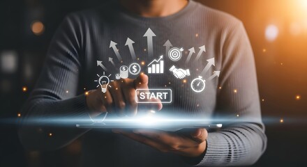 A person touching a start button on a digital interface with business related icons around it