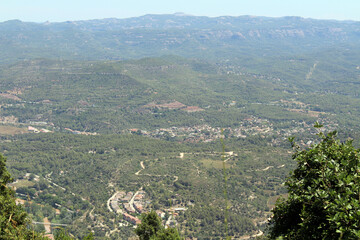 View overlooking the town and surrounding landscape from Montserrat monastery in Catalonia, Spain, taken in July 2024.
