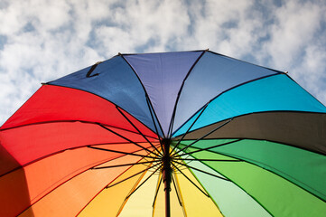 The street is decorated with many red color open umbrellas