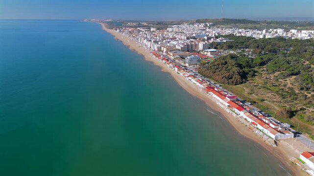 Aerial view of Guardamar del Segura on the Costa Blanca in Spain, showcasing long golden sandy beaches, clear Mediterranean waters, and a well-maintained urban coastline.