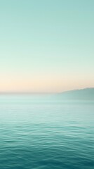 Serene Water Horizon: A tranquil scene of vast ocean waters meeting a muted horizon, creating a peaceful atmosphere. A soft gradient of colors that evokes calmness.