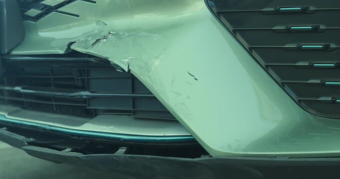 Close-up of car damage after a traffic collision, illustrating the auto insurance claim process, vehicle insurance coverage, accident repair, and motor insurance protection concept