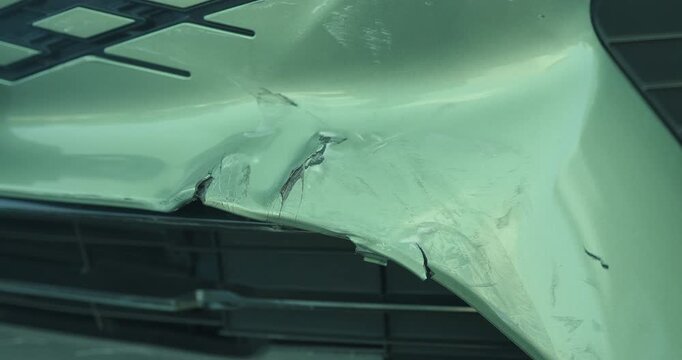 Close-up of car damage after a traffic collision, illustrating the auto insurance claim process, vehicle insurance coverage, accident repair, and motor insurance protection concept
