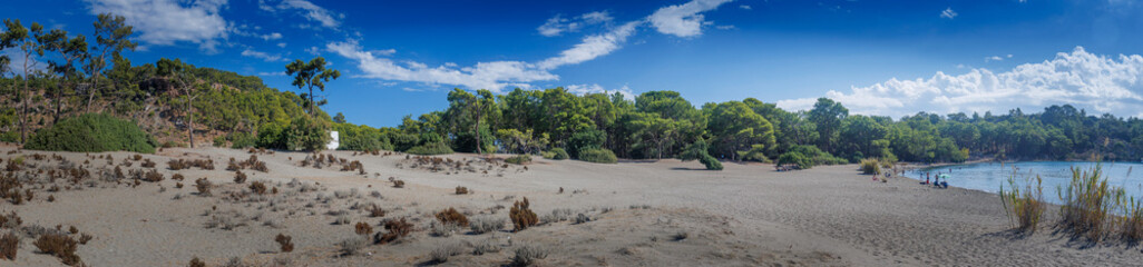 Scenic mountains, pine forests, sandy beaches, turquoise sea, bays, coves, Taurus Mountains views, Mediterranean coastline, nature reserve, ecological park, Wild beaches, gray sand shore