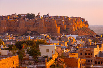 Panorama of Jaisalmer Fort - one of the largest forts in the world, known as the Golden Fort Sonar quila on sunset. Jaisalmer, Rajasthan, India