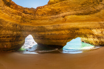 The sea caves of Benagil with natural windows on the clear waters of the Atlantic Ocean, Faro District, Algarve, Portugal, Europe © MASSIMILIANO