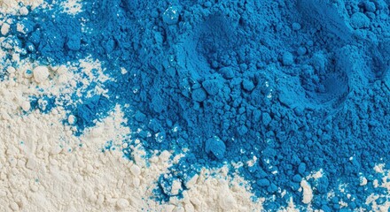 Abstract texture of vibrant blue dye powder mixed unevenly into piles of white baking flour, creating a dramatic color contrast ,art ,strong color ,dust