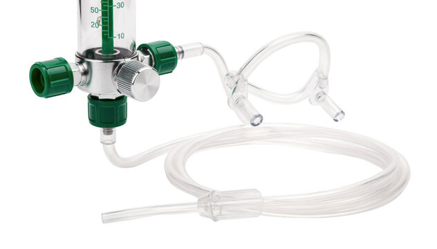 Medical oxygen flowmeter and l cannula isolated on white emphasizing essential equipment used to assist patients with mild breathlessness in clinical settings.