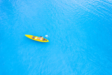 Aerial view of a kayak in the blue sea .man kayaking he does water sports activities.