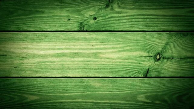 Green wooden planks backdrop closeup