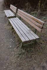 Fototapeta premium Frosty Wooden Benches in Winter Park