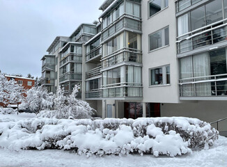 Sweden. A multi-story building surrounded by snow-covered trees on a winter morning.