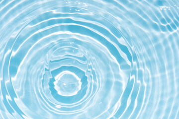 Blue water with ripples on the surface. Defocus blurred transparent blue colored clear calm water...
