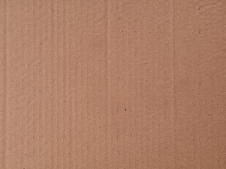 Fototapeta premium Brown corrugated cardboard texture background. perfect for eco-friendly packaging design, shipping concepts, or rustic background
