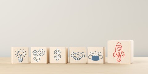 Row of wooden blocks with team, process, partnership and investment icons to start up rocket icon, startup, innovation or business invention concept