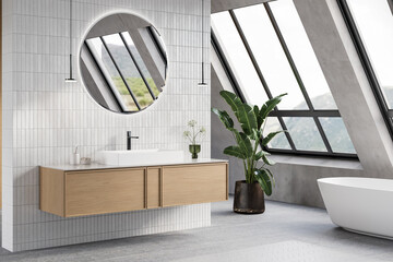 Modern bathroom interior with gray and white tiles wall, concrete floor, wooden vanity with black sink and oval mirror, white bathtub, shower, panoramic windows. 3d Rendering