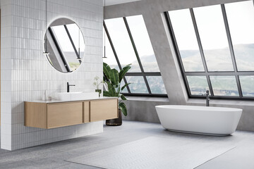 Modern bathroom interior with gray and white tiles wall, concrete floor, wooden vanity with black sink and oval mirror, white bathtub, shower, panoramic windows. 3d Rendering