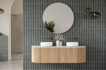 Modern bathroom interior with beige and green tiles wall, concrete floor, wooden vanity with black sink and oval mirror, toilet, shower. 3d Rendering