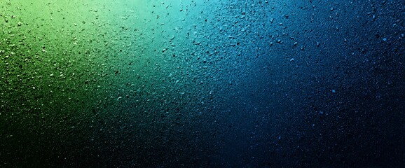 Obraz premium Water droplets on foggy window with green blue gradient background