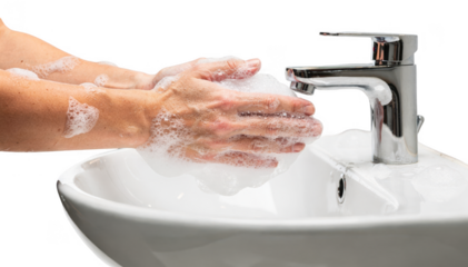 Isolated image of hands rubbing together with soap in a bright clean public restroom sink setting highlighting hygiene in shared spaces.