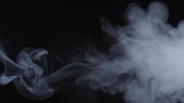 Wisps of white smoke billow and swirl against a dark background.