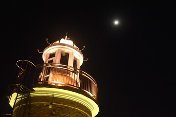 landscape of lighthouse on jetty sea in twilight sky at Ang sila beach travel location in Thailand
