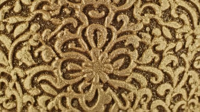 Golden Ornate Pattern Close-Up - Intricate Design and Texture.
