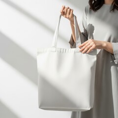 Woman holding white tote bag 3.