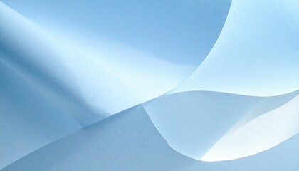 Curving translucent blue fabric creates an airy, ethereal composition with soft lighting and flowing, graceful lines